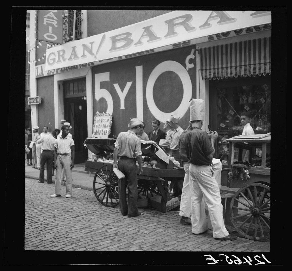 Pushcart vendors in front of a five and ten store. San Juan, Puerto Rico. Sourced from the Library of Congress.