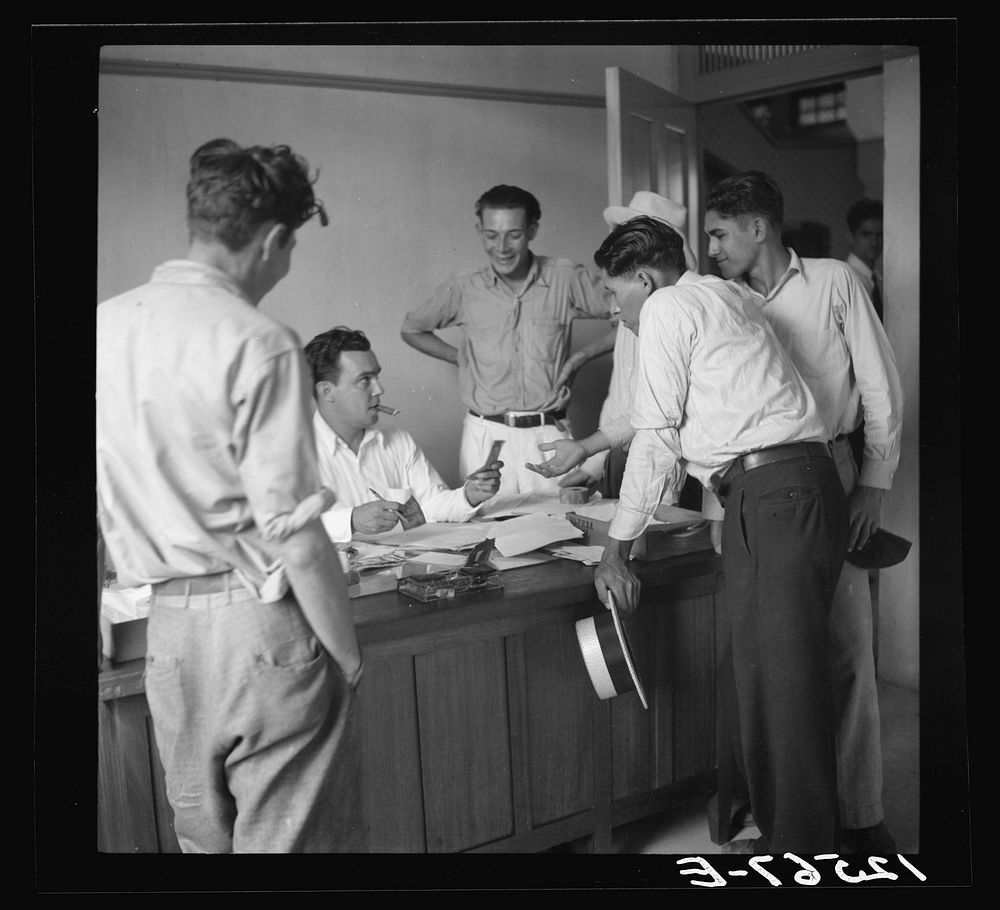 Resettlers being paid for work done on the project. La Plata project. Puerto Rico. Sourced from the Library of Congress.