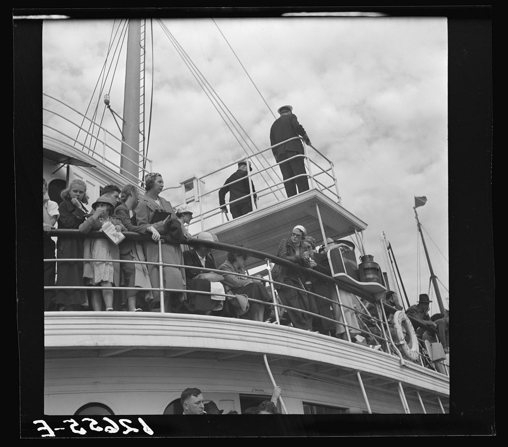 Tourists getting aboard the "Steel Pier" on their return trip to Boston. During the season two boats arrive daily at two and…