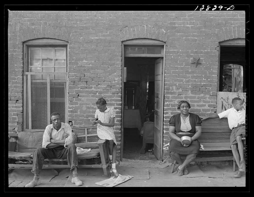  family and their home in one of the alley dwelling sections.  Washington, D.C.. Sourced from the Library of Congress.