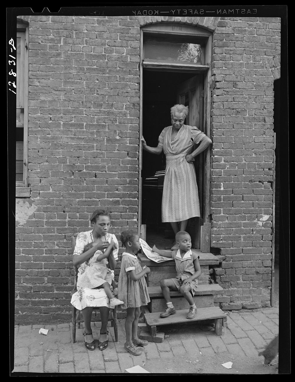  family and their home in one of the alley dwellings. Washington, D.C.. Sourced from the Library of Congress.
