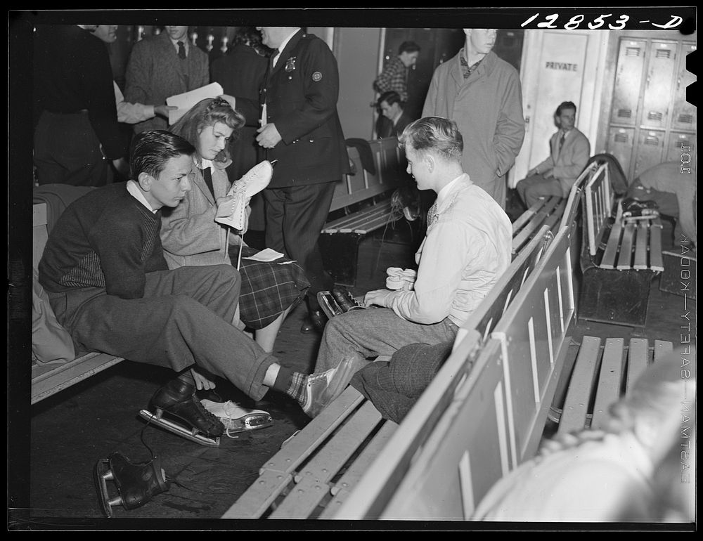 Chevy Chase Ice Palace, Washington. D.C. Skaters fastening skates. Sourced from the Library of Congress.