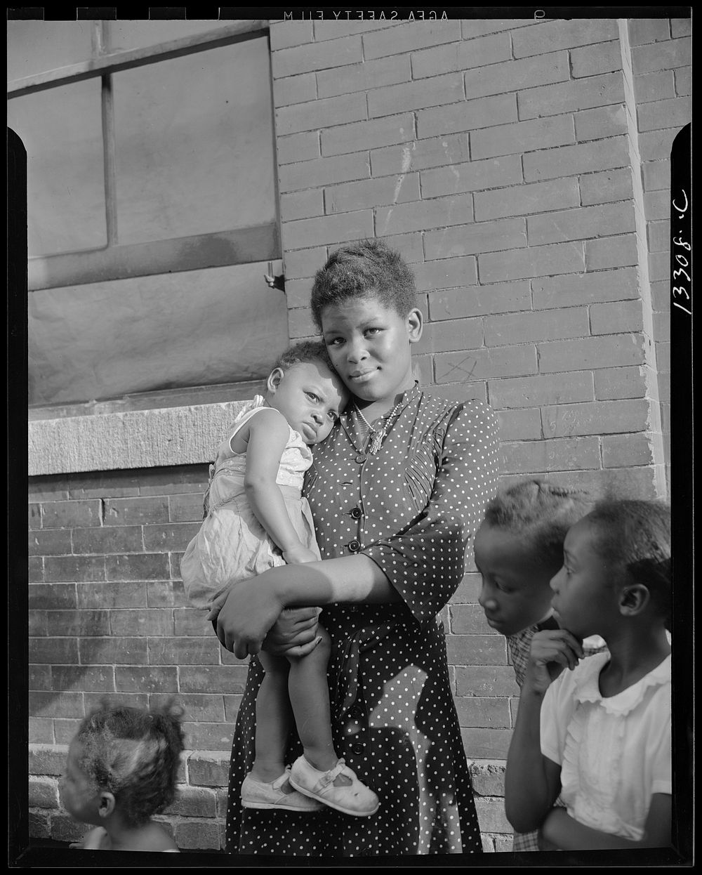 Washington, D.C. Young girl with her sister who live on Seaton Road. Sourced from the Library of Congress.