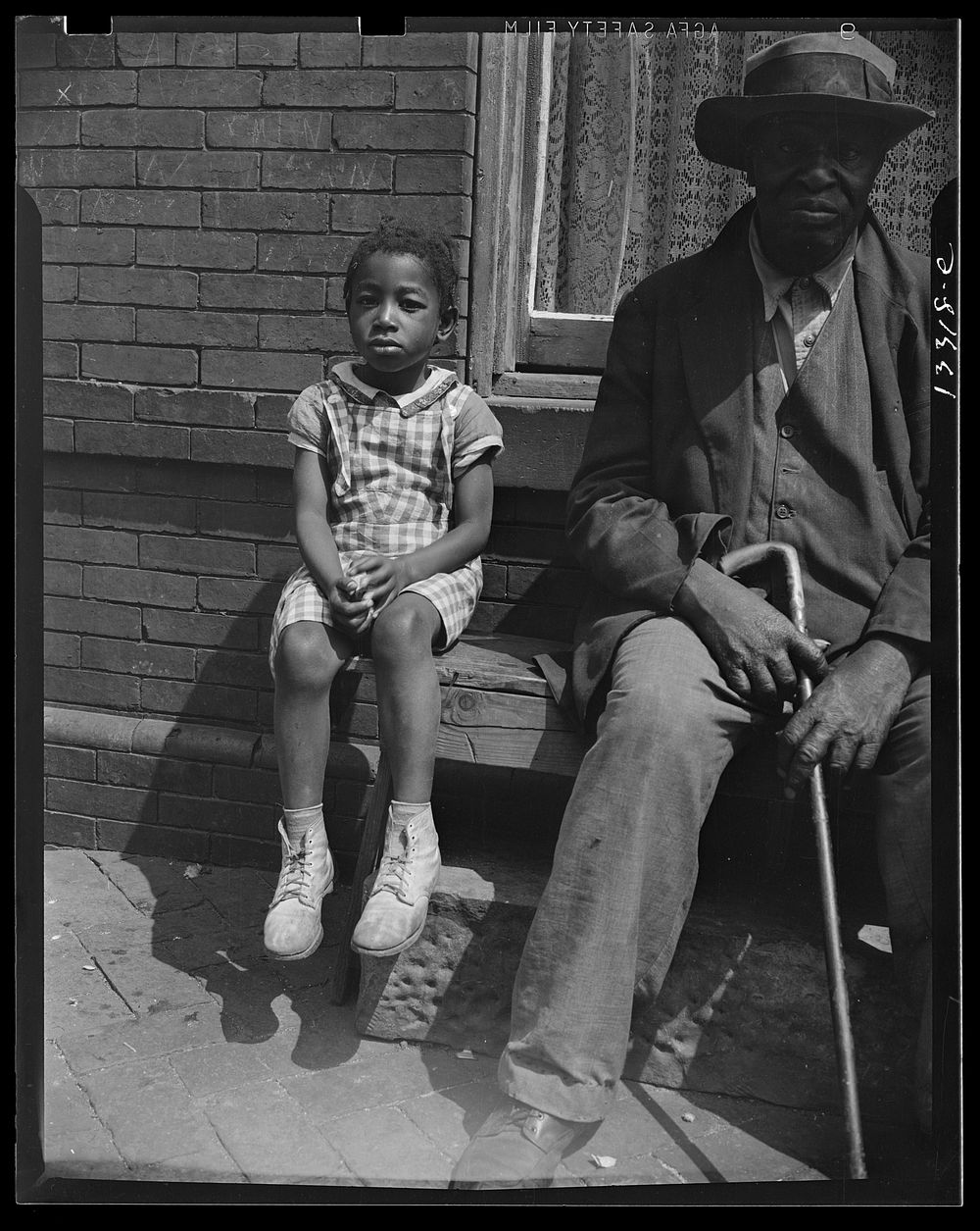 Washington, D.C. Grandfather and grandchild who live on Seaton Road. Sourced from the Library of Congress.