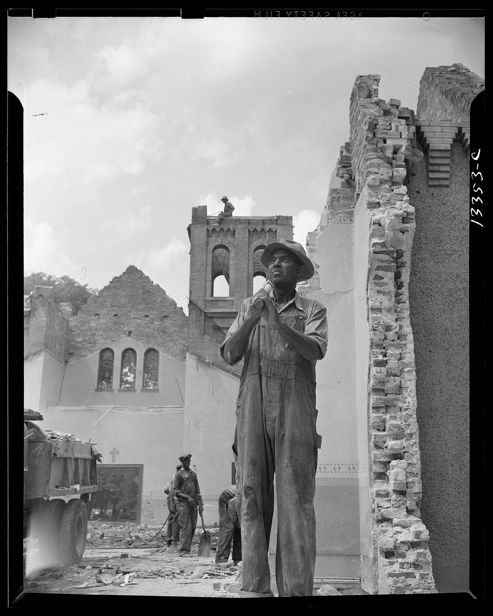 Washington, D.C. Construction workman wrecking a church on Independence Avenue. Sourced from the Library of Congress.