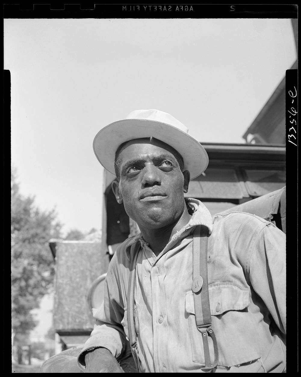 Washington, D.C. Laborer listening to instructions being given by a section foreman. Sourced from the Library of Congress.