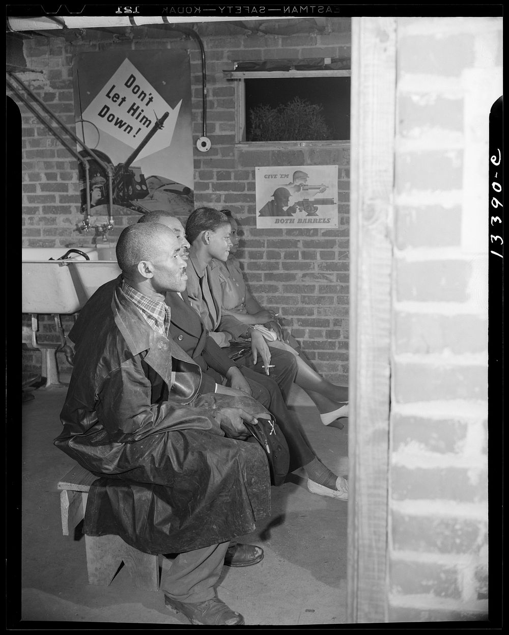 Washington, D.C. Air raid wardens' meeting in zone nine, Southwest area. Air raid wardens attending a meeting. Sourced from…
