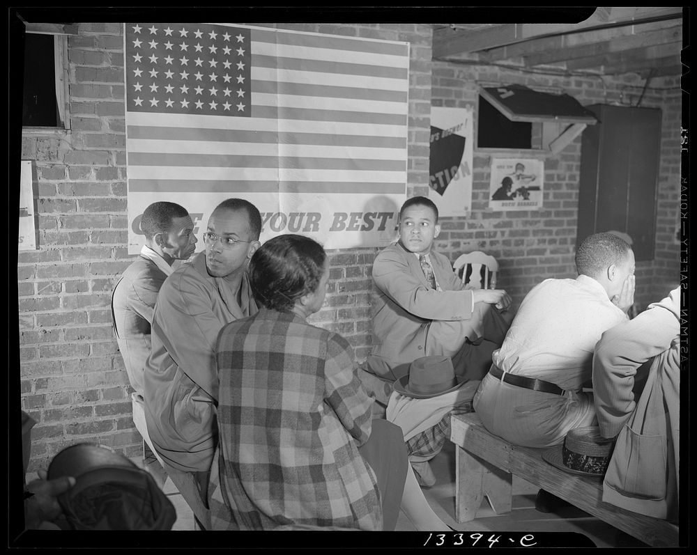 Washington, D.C. Air raid wardens' meeting in zone nine, Southwest area. Air raid wardens listening to a report by one of…