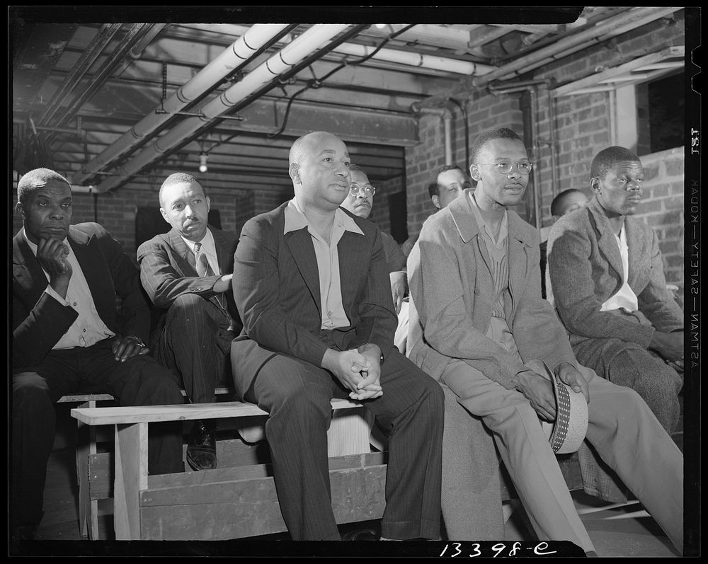 Washington, D.C. Air raid wardens' meeting in zone nine, Southwest area. Air raid wardens attending a meeting in their…