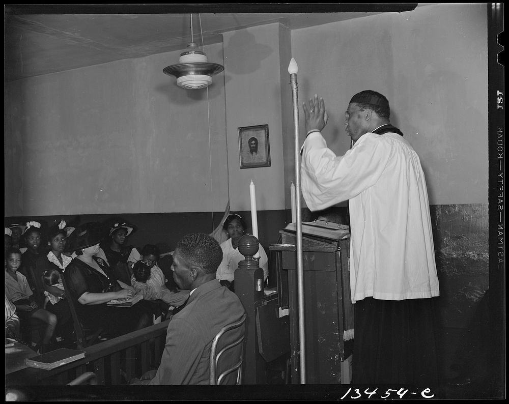 Washington, D.C. Reverend Vondell Gassaway, pastor of the St. Martin's Spiritual Church, preaching. Mrs. Ella Watson, a…