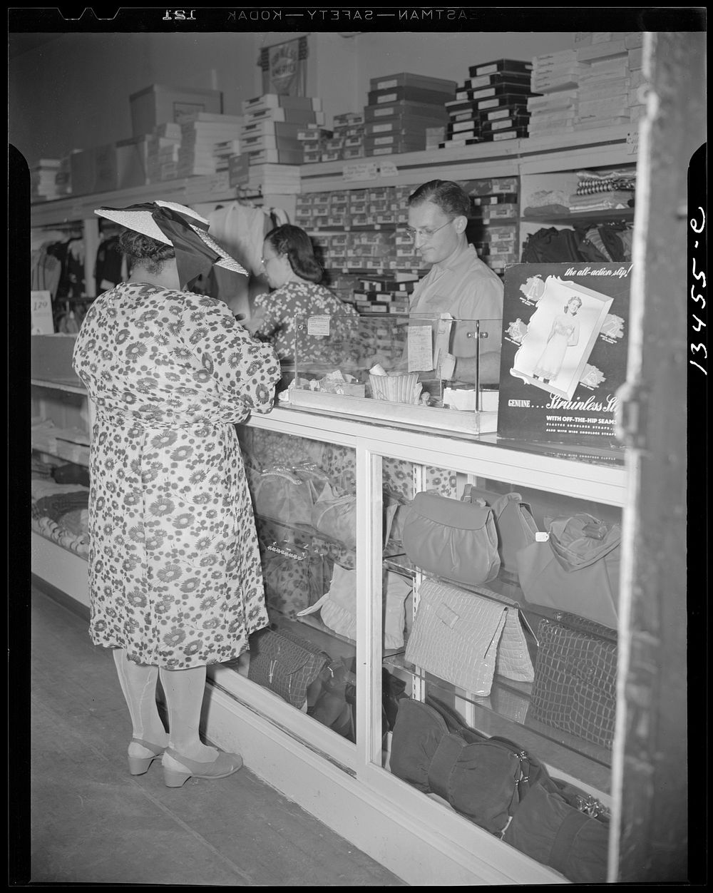 Washington, D.C. Shopper in a store at 7th Street and Florida Avenue, N.W.. Sourced from the Library of Congress.