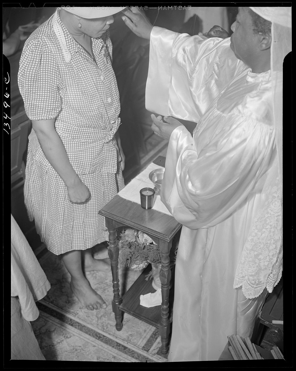 Washington, D.C. Reverend Clara Smith anointing a member of the St. Martin's Spiritual Church during the annual "flower bowl…
