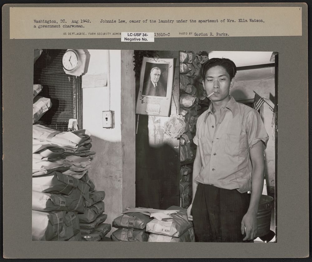 Washington, D.C. Johnnie Lew, owner of the laundry under the apartment of Mrs. Ella Watson, a government charwoman. Sourced…
