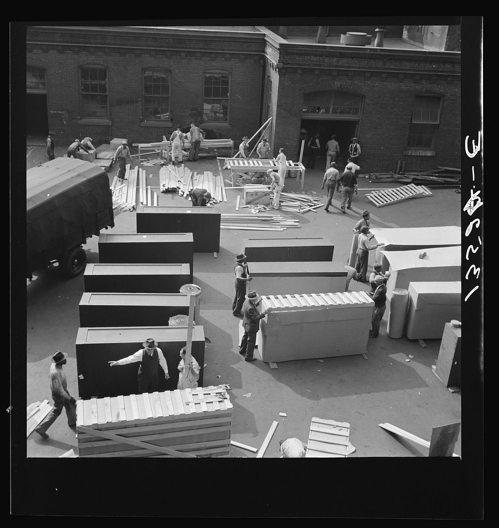 Washington, D.C. United States government workers and carpenters making crates for steel cabinets and preparing them for…
