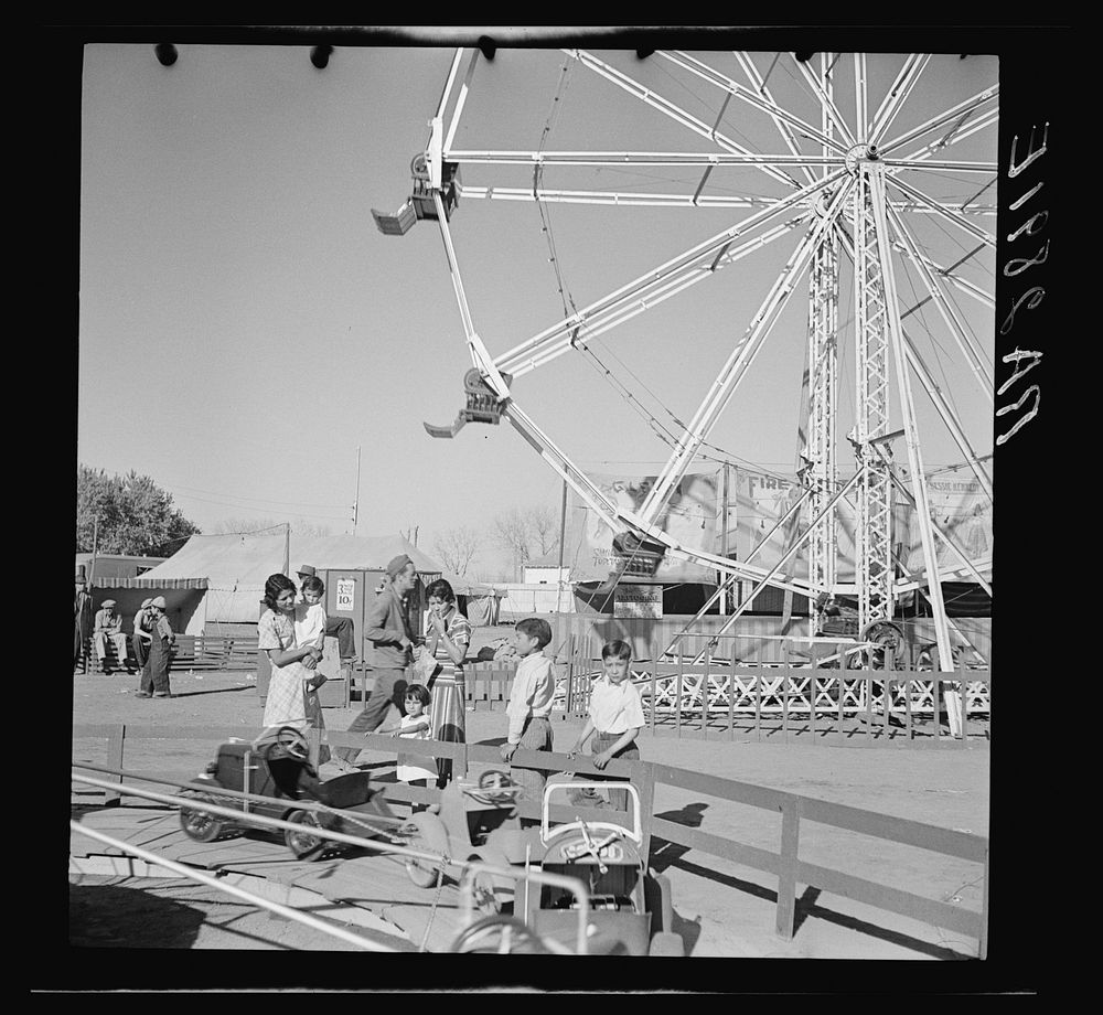 [Untitled photo, possibly related to: Watching the amusements. Carnival at Roswell, New Mexico]. Sourced from the Library of…