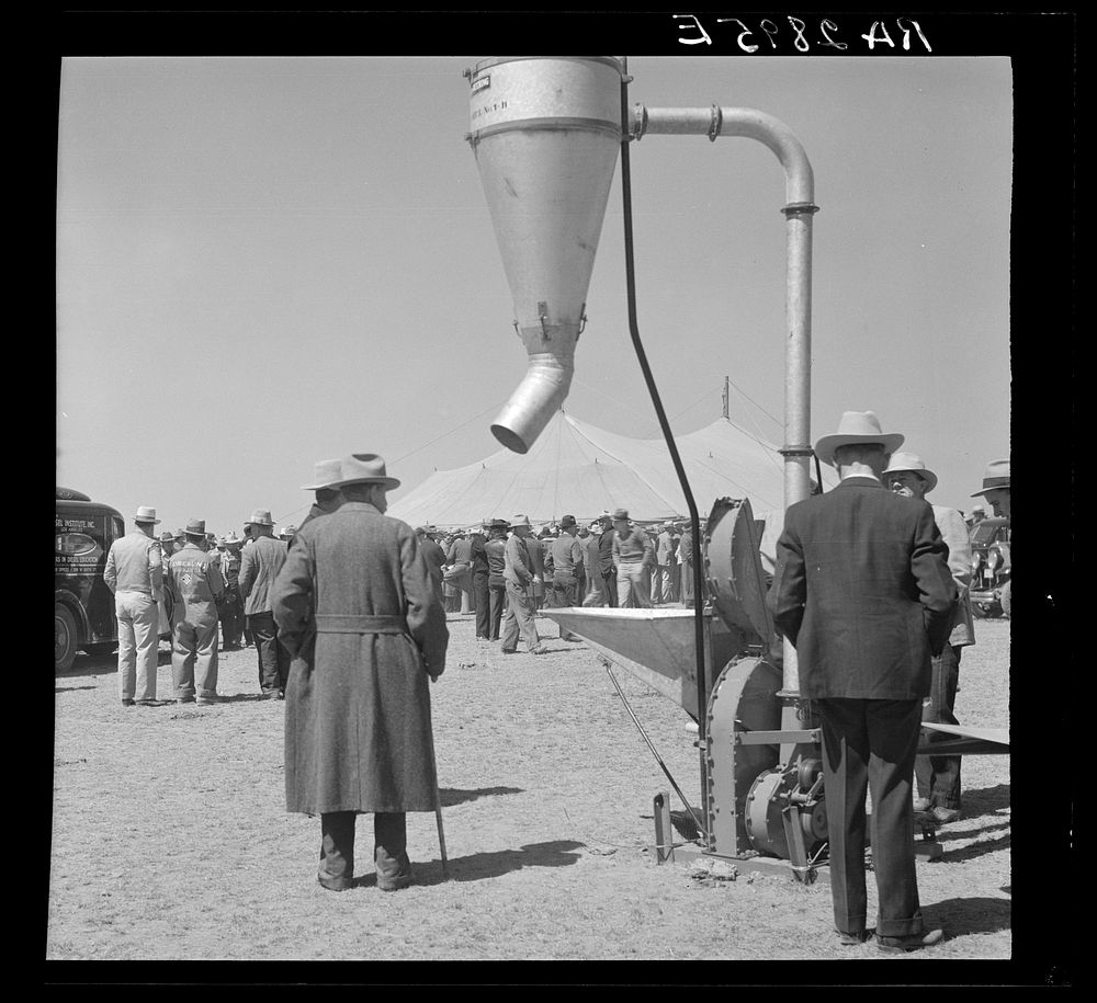 [Untitled photo, possibly related to: Examining farm machinery. Farm implement show. Carson County, Texas]. Sourced from the…