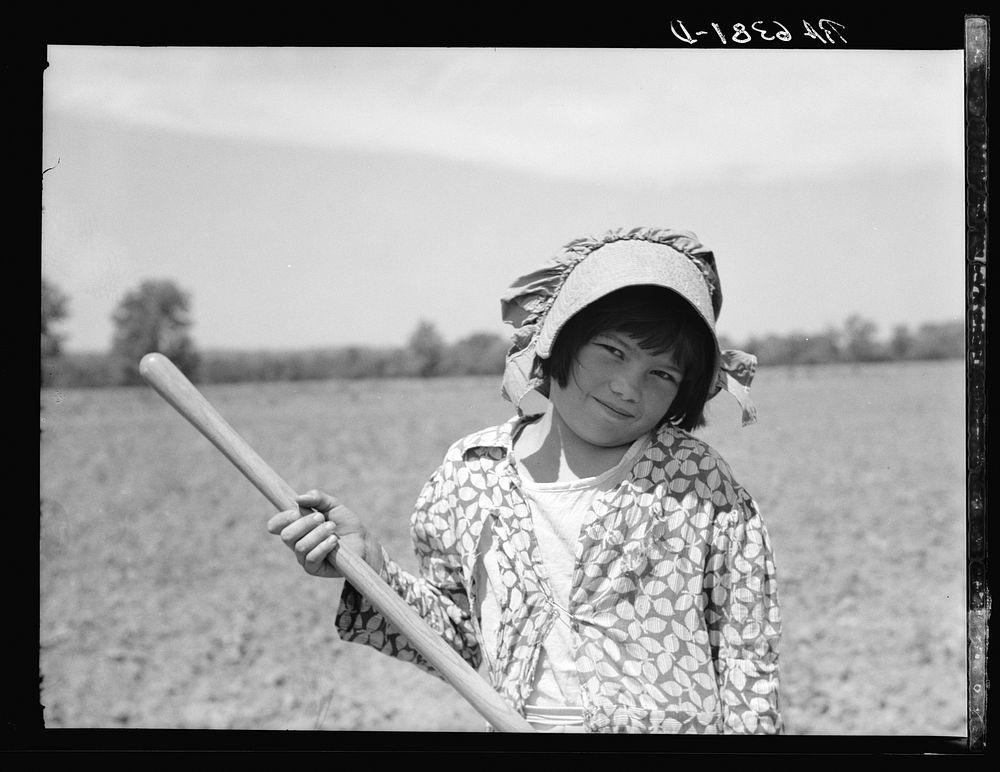 [Untitled photo, possibly related to: R.E. Sneed, rehabilitation client and eight year old daughter on cotton cultivator.…
