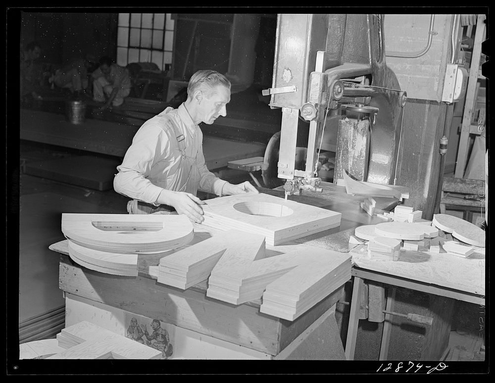 New York, New York. Preparing the defense bond sales photomural, designed by the Farm Security Administration, to be…