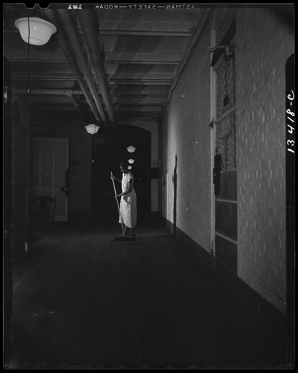 [Untitled photo, possibly related to: Washington, D.C. Government charwoman cleaning after regular working hours]. Sourced…