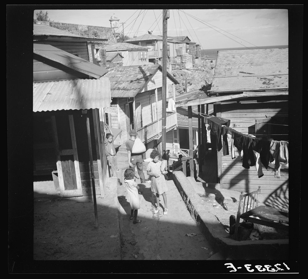 [Untitled photo, possibly related to: Street in the workers' quarter of La Perla. San Juan, Puerto Rico]. Sourced from the…