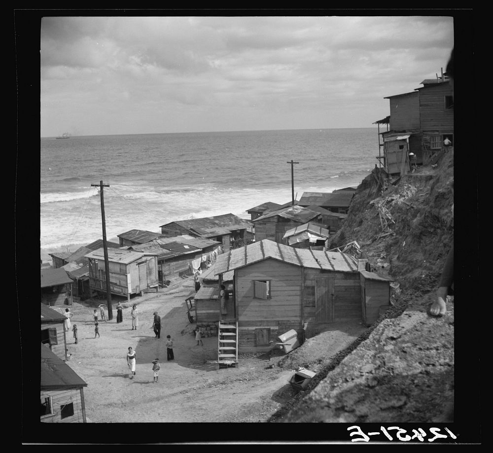 [Untitled photo, possibly related to: View of a portion of the workers' quarter of La Perla from the old Spanish ramparts.…