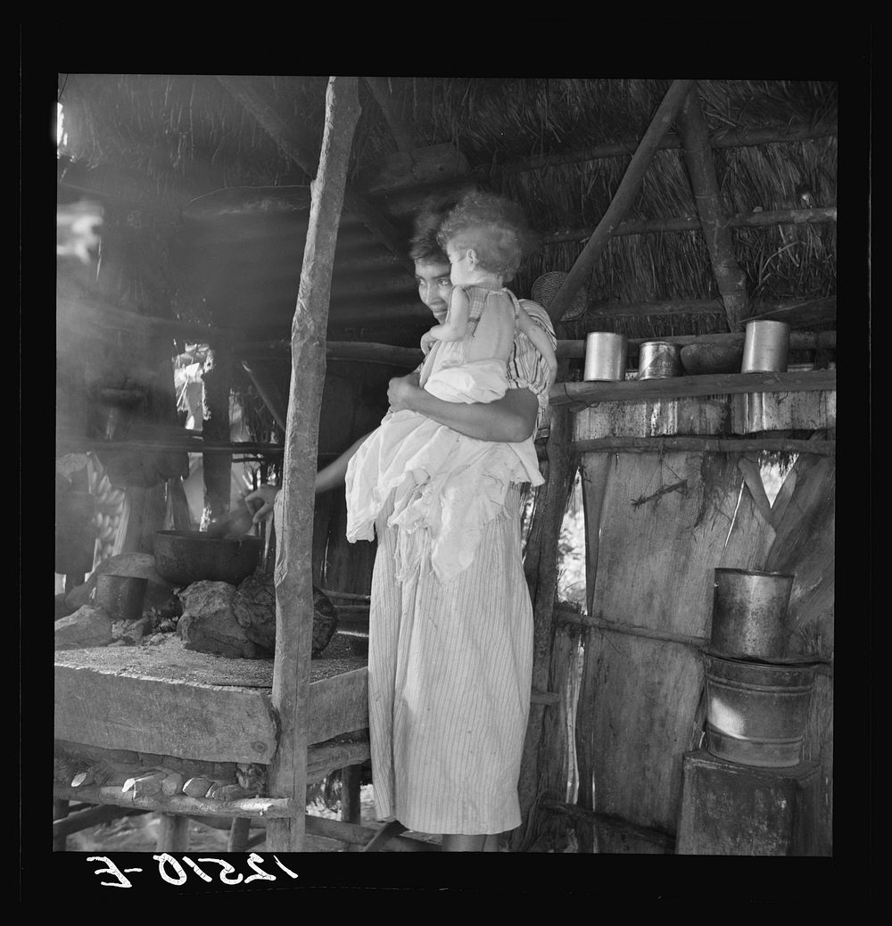 [Untitled photo, possibly related to: Wife and child of Jibaro tobacco worker near Cidra, Puerto Rico]. Sourced from the…