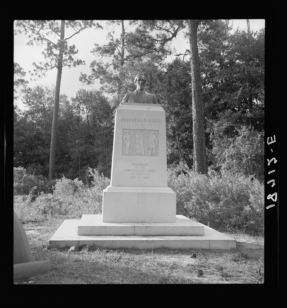 [Untitled photo, possibly related to: Monument on eighty-acre state memorial park, Jefferson Davis Park, bound on three…