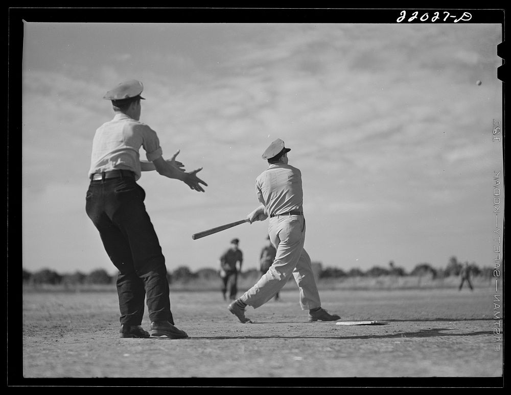 Weslaco, Texas. FSA (Farm Security Administration) camp. Baseball game. Saturday afternoon. Sourced from the Library of…