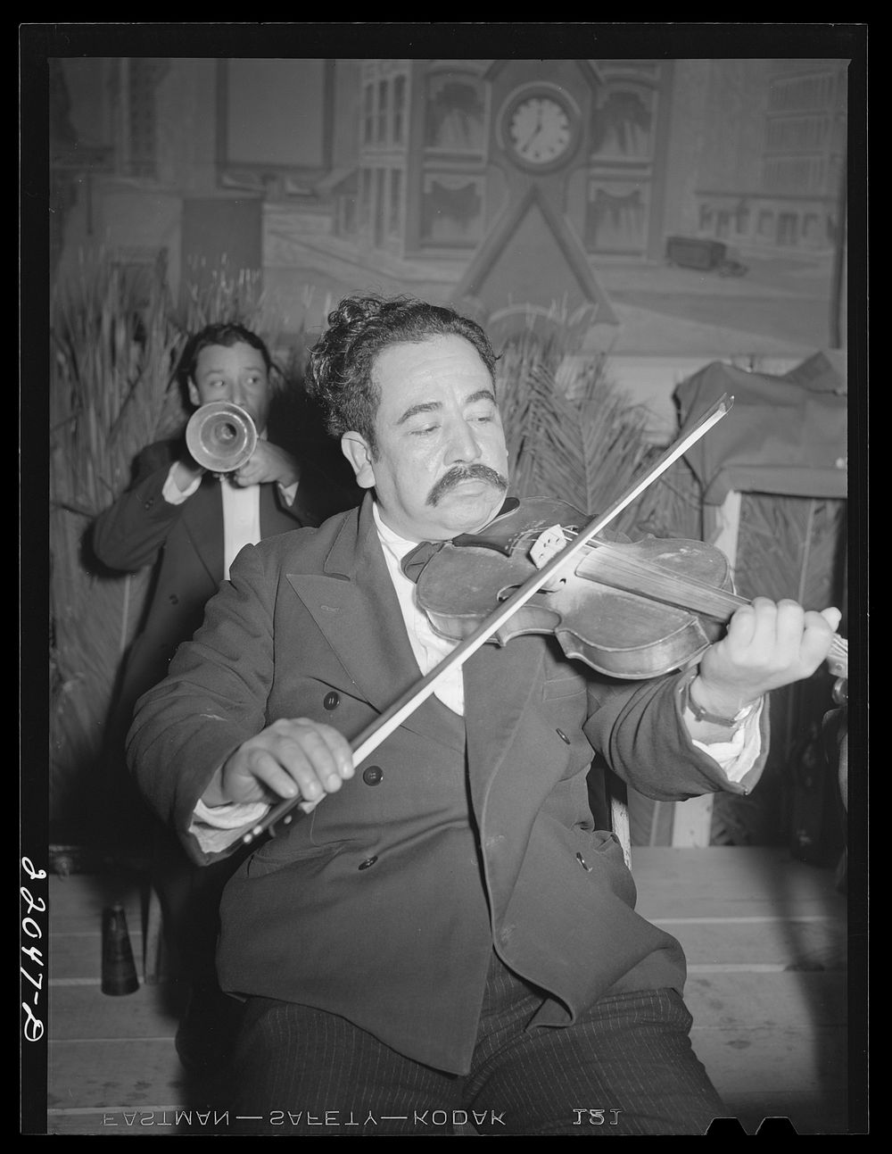 Brownsville, Texas. Charro Days fiesta. Member of Mexican orchestra at El Rancho Grande. Sourced from the Library of…