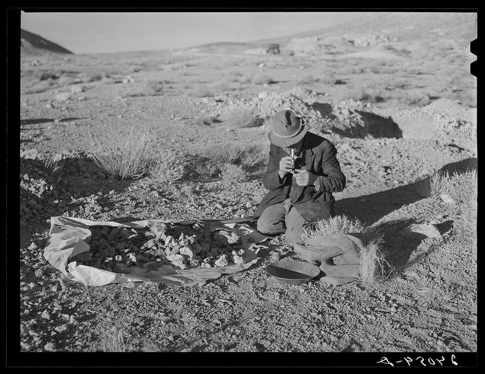 [Untitled photo, possibly related to: Prospector testing ore samples. Esmeralda County, Nevada]. Sourced from the Library of…