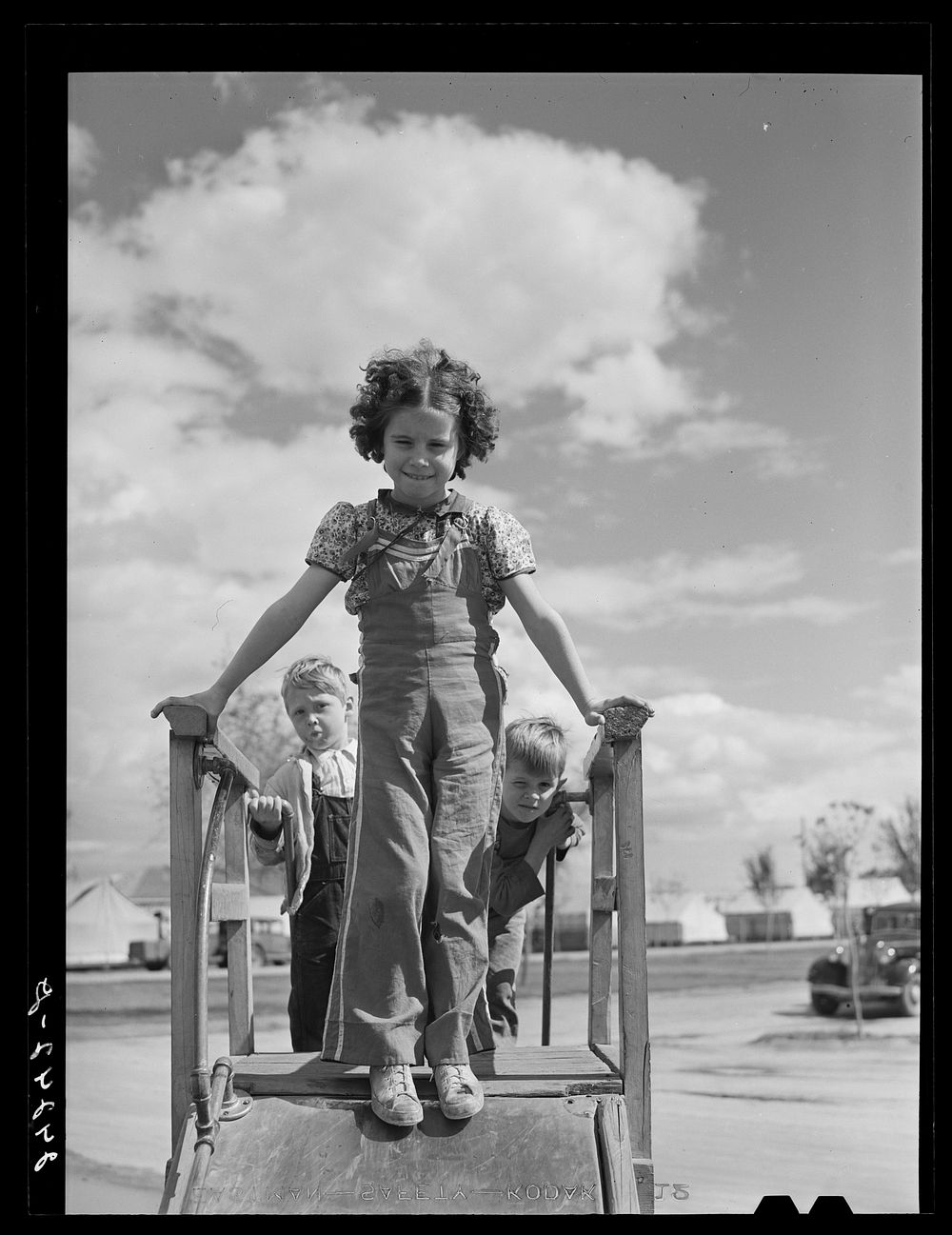 Children on slide. Shafter migrant camp. Shafter, California. Sourced from the Library of Congress.