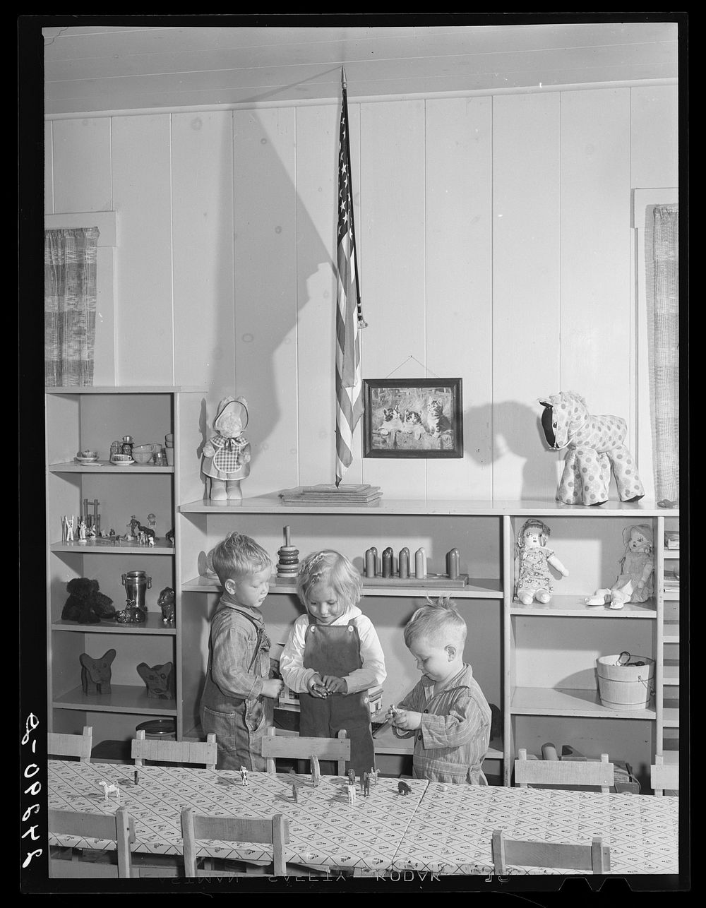 Children playing in nursery. Shafter migrant camp. Shafter, California. Sourced from the Library of Congress.