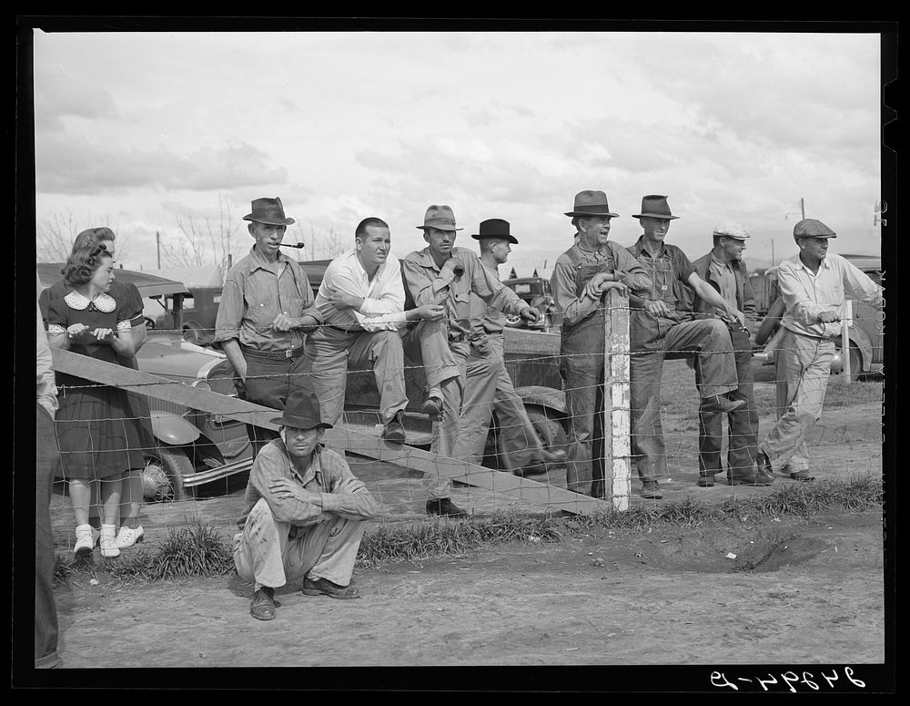 Watching a Sunday afternoon baseball game. Tulare migrant camp. Visalia, California. Sourced from the Library of Congress.