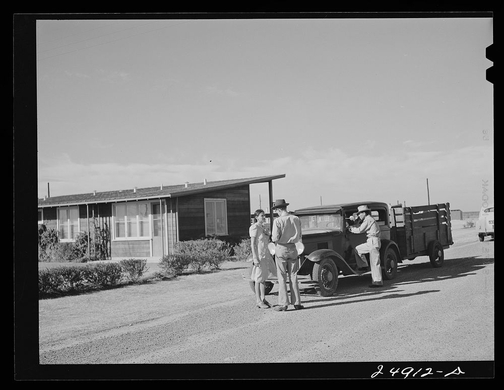 Camp manager says good-bye to family leaving camp. Robstown FSA (Farm Security Administration) camp, Texas. Sourced from the…