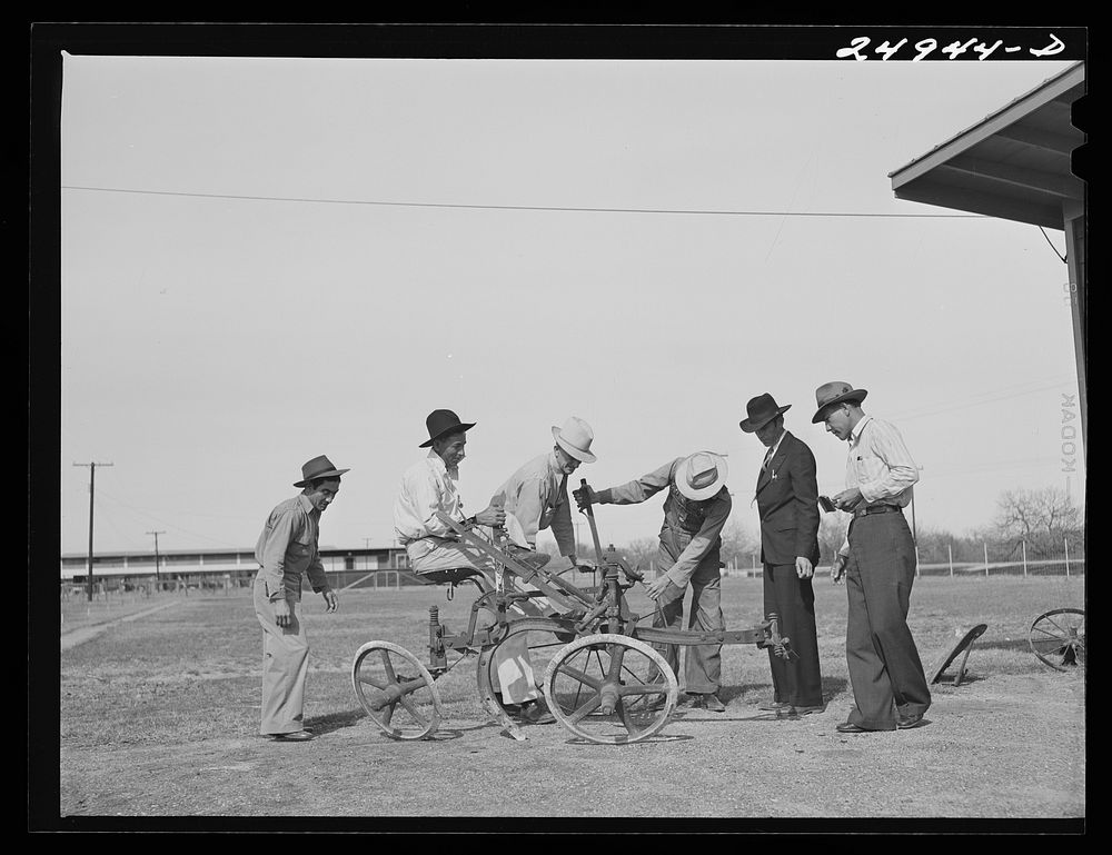 Sinton, Texas. FSA (Farm Security Administration) camp. Community council examines new plow for use in community gardens.…