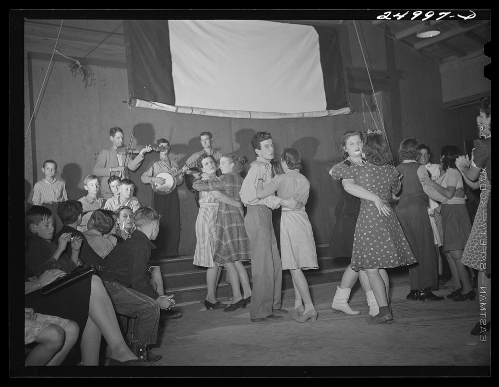 [Untitled photo, possibly related to: Weslaco, Texas. FAS (Farm Security Administration) camp. Drake family playing for a…