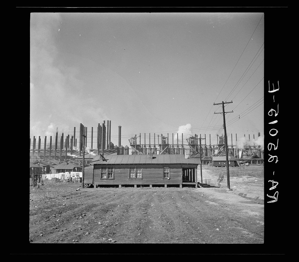 Company house near steel mill. Small garden plot in foreground. Ensley, Alabama. Sourced from the Library of Congress.
