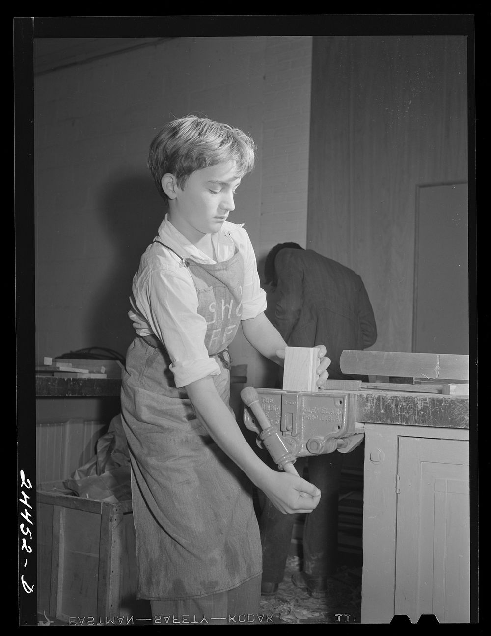 Boy in shop class who was shop foreman for the week. Homestead school.  Dailey, West Virginia. Sourced from the Library of…
