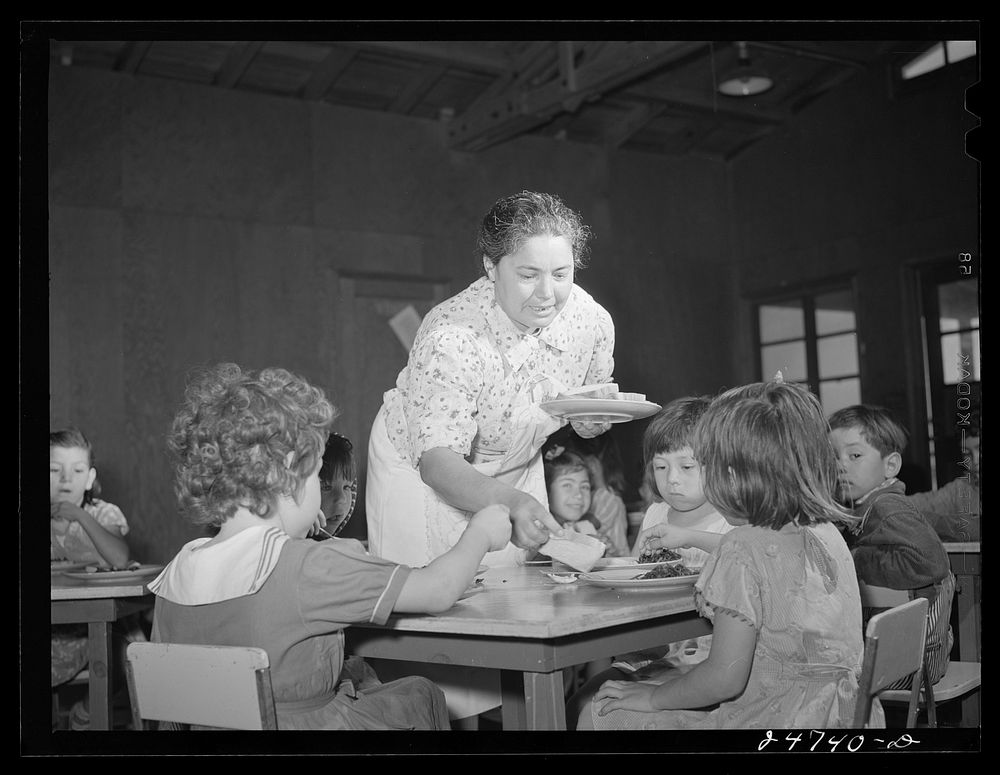 Robstown, Texas. FSA (Farm Security Administration) migratory workers' camp. Member of mothers' committee serving lunch in…