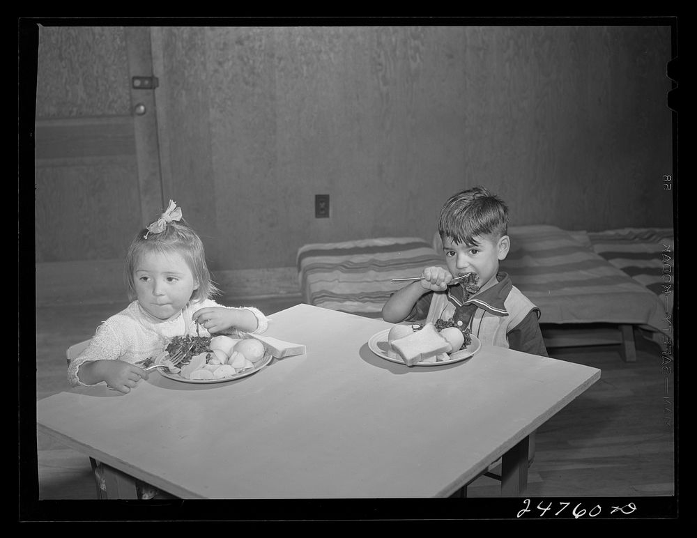 Latin-American child at lunch. Nursery school, FSA (Farm Security Administration) camp. Robstown, Texas. Sourced from the…