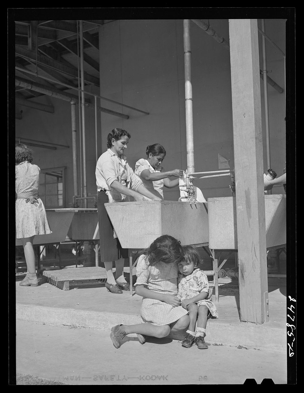[Untitled photo, possibly related to: Community laundry. FSA (Farm Security Administration) camp, Robstown, Texas]. Sourced…
