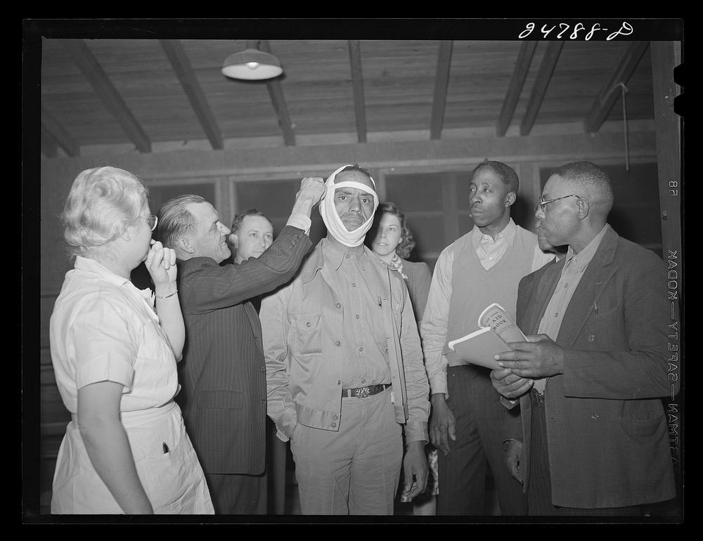 First aid meeting at community center. FSA (Farm Security Administration) camp, Robstown, Texas. Sourced from the Library of…