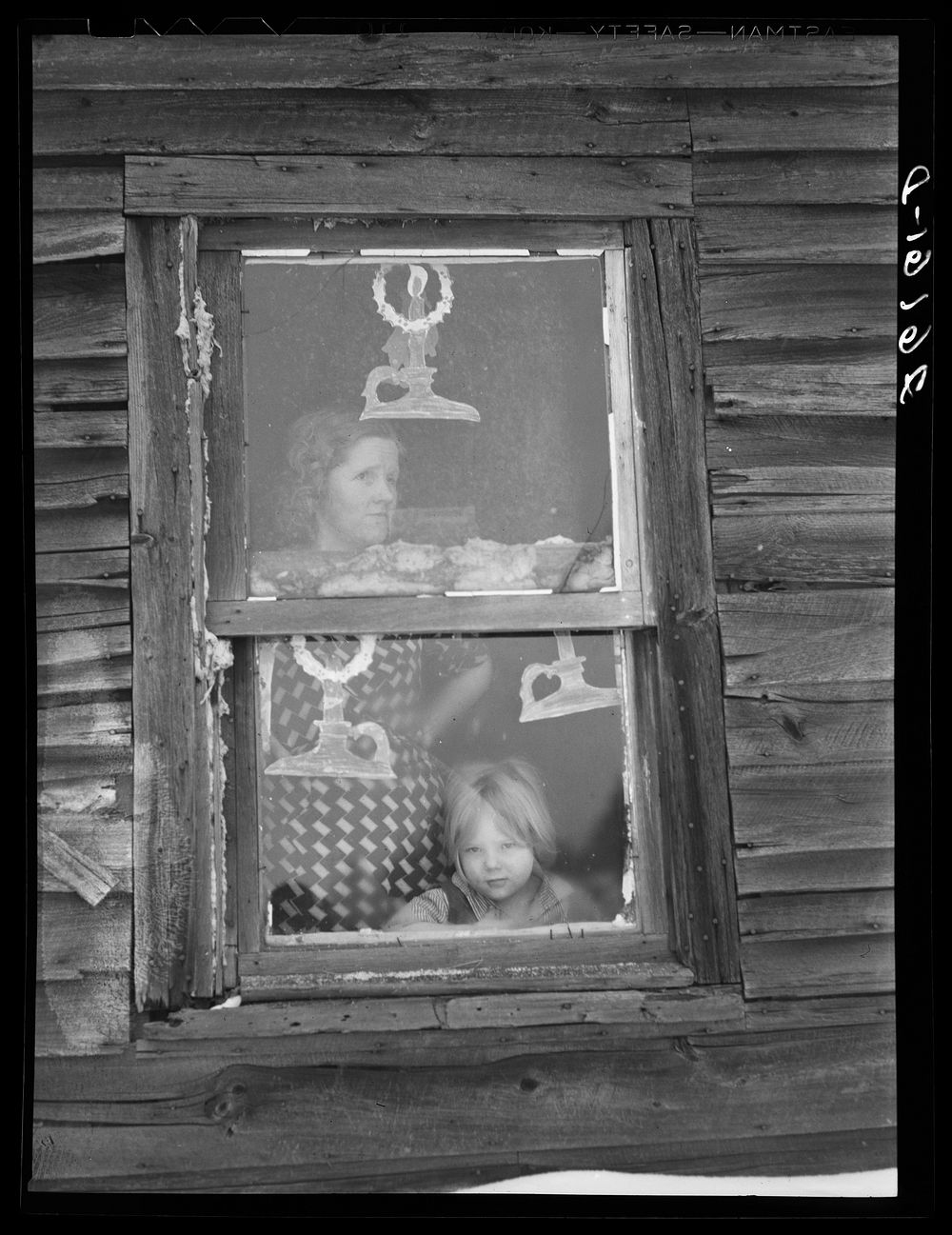 Wife and child of submarginal farmer. Oswego County, New York. Sourced from the Library of Congress.