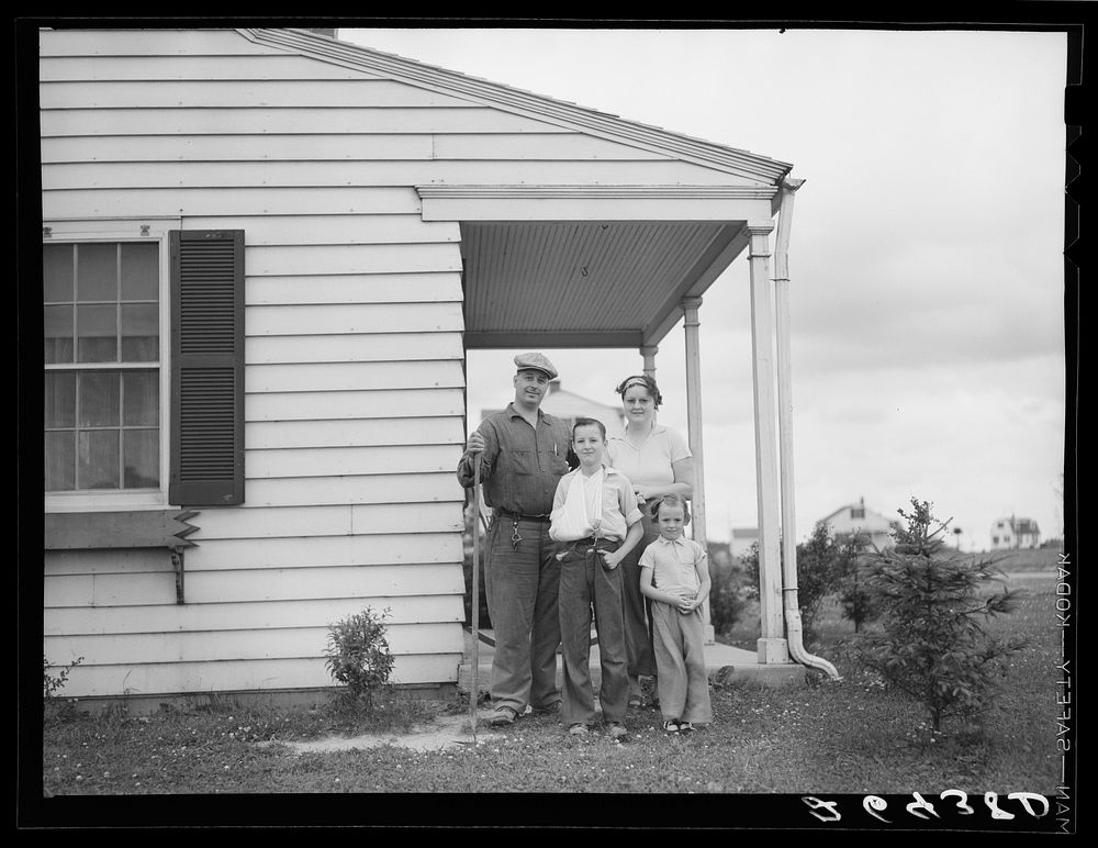 [Untitled photo, possibly related to: The Bollinger family in front of their home. Decatur Homesteads, Indiana]. Sourced…