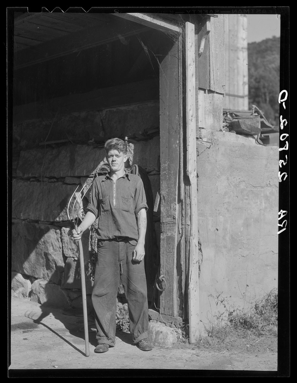 Hired hand. McNally farm, Kirby, Vermont. Sourced from the Library of Congress.