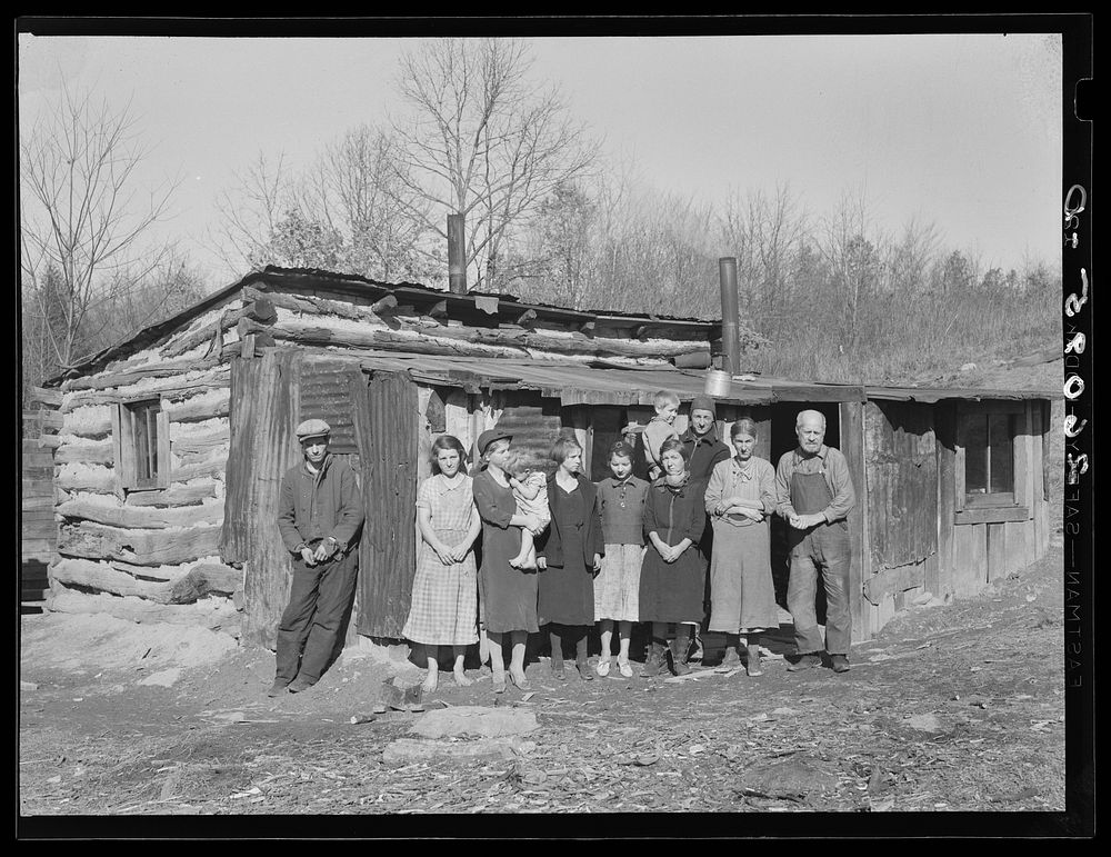 The Bittenger family and his cabin in which they live. Garrett County, Maryland. Sourced from the Library of Congress.