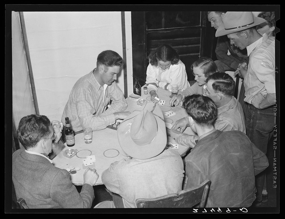 Dudes and cowhands in poker [i.e.jack] game. Birney, Montana. Sourced from the Library of Congress.