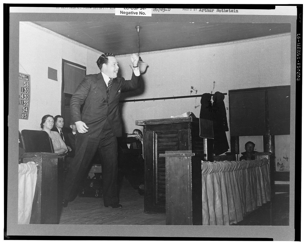 Evangelist preaching sermon. Pentecostal church, Cambria, Illinois. Sourced from the Library of Congress.