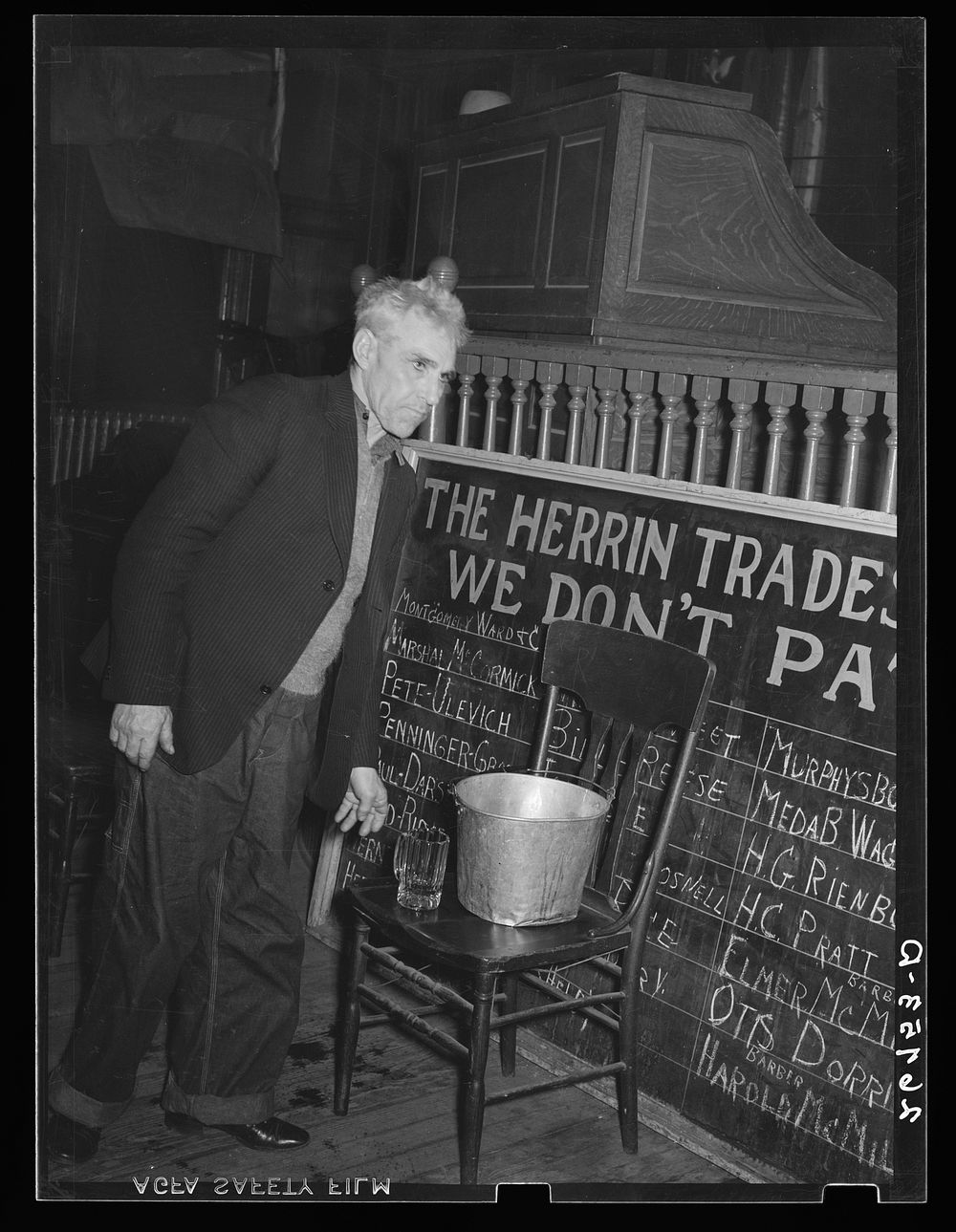 Miner getting a drink of water at local meeting of UMWA (United Mine Workers of America). Herrin, Illinois. Sourced from the…