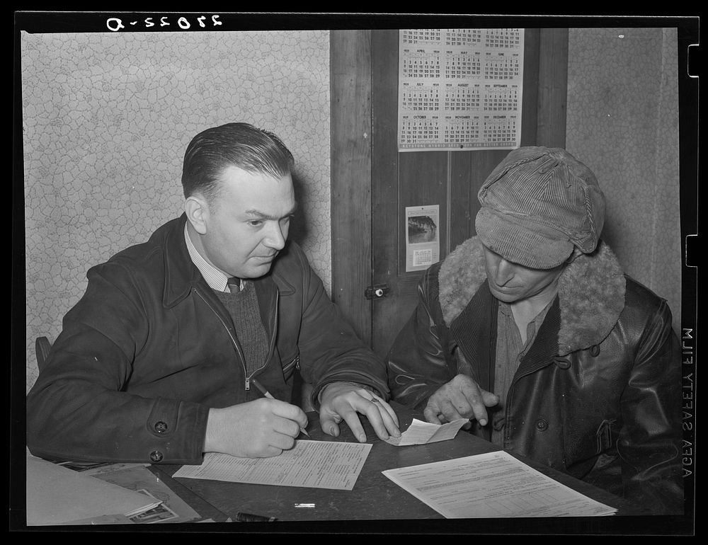 [Untitled photo, possibly related to: Rehabilitation Administration supervisor with farmer applying for loan. Ridgeway…